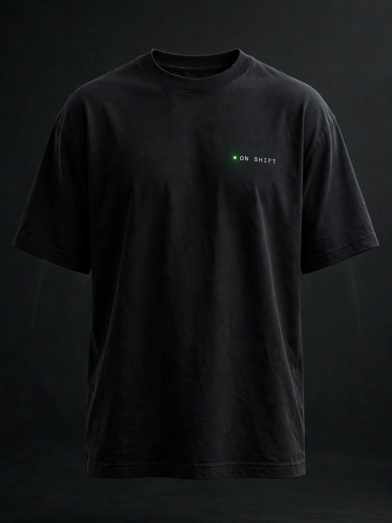Heavyweight Boxy Tee in black with a small green dot and ON SHIFT embroidered on the chest